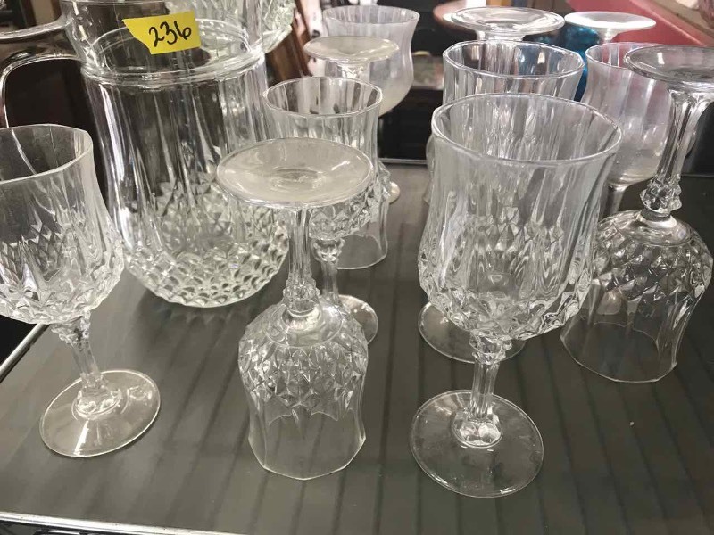 lot 236 image: Clear glass pitcher, stemware, tall vase