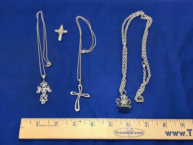 lot 131 image: (3) Necklaces crosses & angel bell