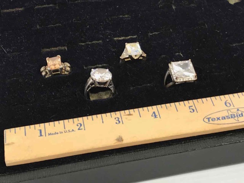 lot 147 image: (4) Rings Square Clear 9, Peach 7-12, Irridescent 7, Round Clear 7-34.