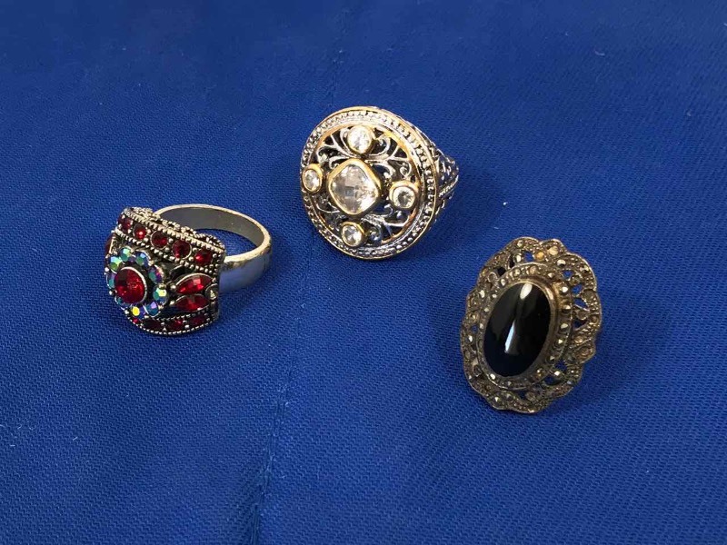 lot 149 image: (3) Rings Black Oval 6-12, Red Dome 9, Round Clear 7