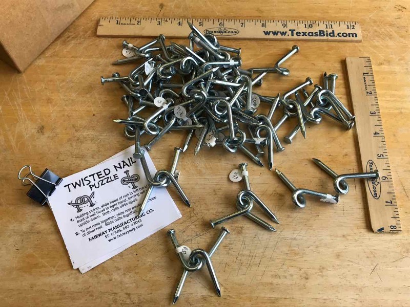 lot 479 image: (31) Twisted Nail Puzzles