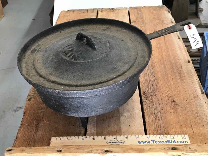 lot 549 image: Cast Iron Footed Dutch Oven with Lid