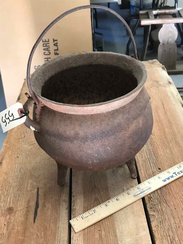 lot 555 image: Cast Iron  Footed Kettle with Bail