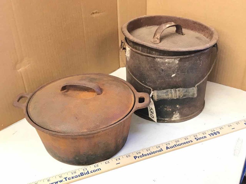lot 580 image: Cast Iron Stock Pot with Lid & an Old Rusty Pail