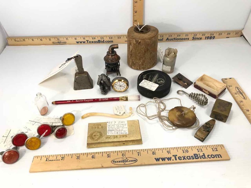 lot 652 image: Coin Bank, Button & String Toy, LP Reflectors, Pencil Sharpener, Metal Monkey Clock, Fake Gold Bar, Pill Box, Etc.