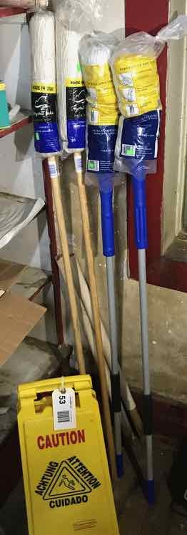 lot 53 image: (4) New Mops, (1) Yellow Caution Sign