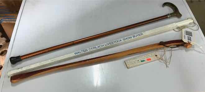 lot 303 image: (2) Walking Canes, (1) Livestock Cane Yardstick