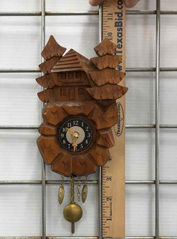 lot 79 image: Little Carved Wall Clock (battery operated)