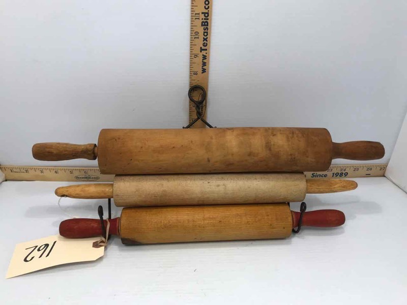 lot 162 image: (3) Wood, Solid Rolling Pins, (1) Wire Hanger