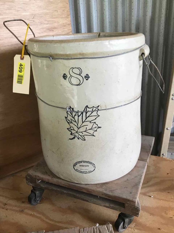 lot 409 image: Old Western Stoneware Crock (cracked) and plant rolling stand