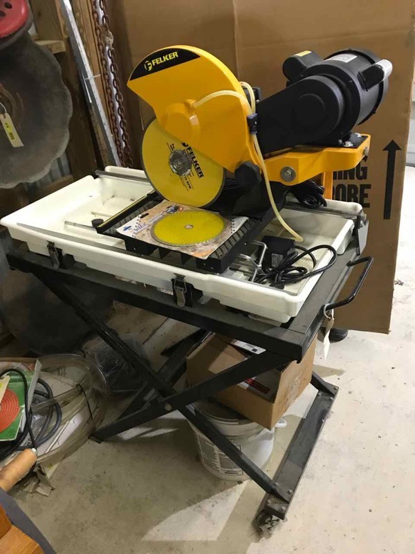 lot 20 image: Feller Tile Saw (used one time)... like new and includes stand
