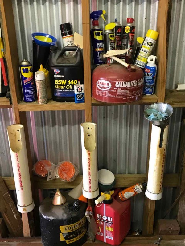 lot 58 image: Gas cans and lubricants