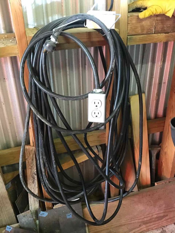 lot 61 image: Heavy Duty black extension cord with duplex plug
