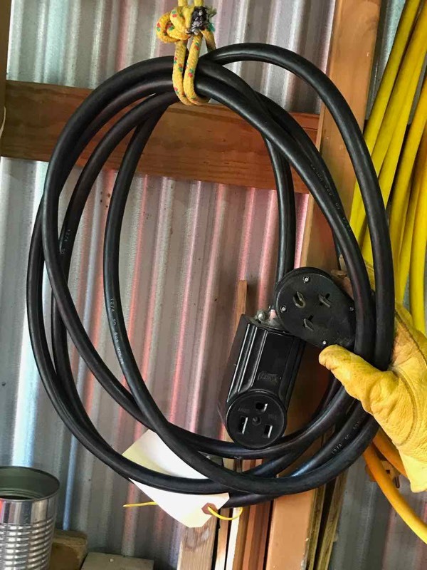 lot 63 image: Black 50 Amp extension cord (124)