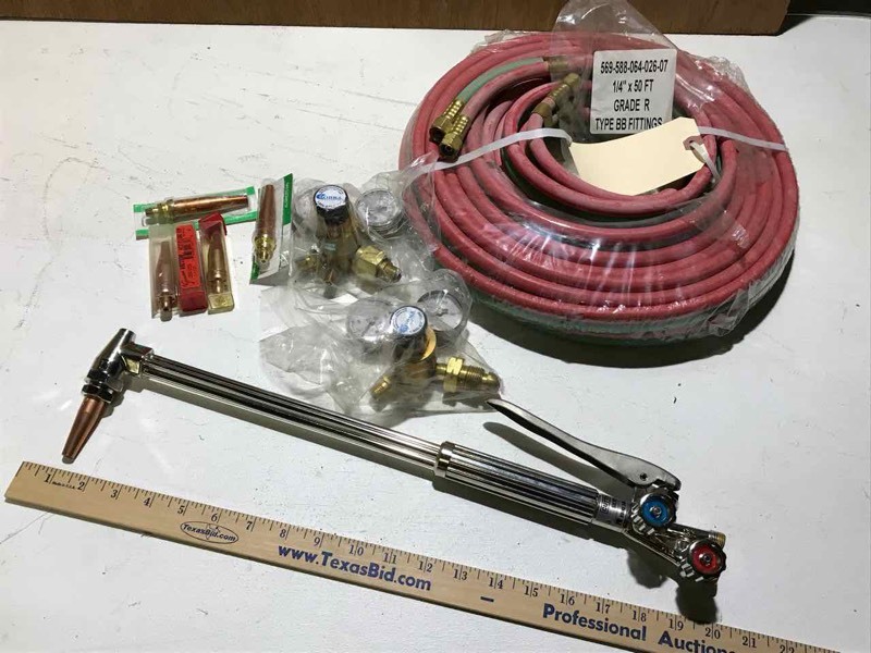 lot 78 image: Koike Silver Cut 250 torch, 50 ft hose, Cobra gauges, assorted tips (new in box)