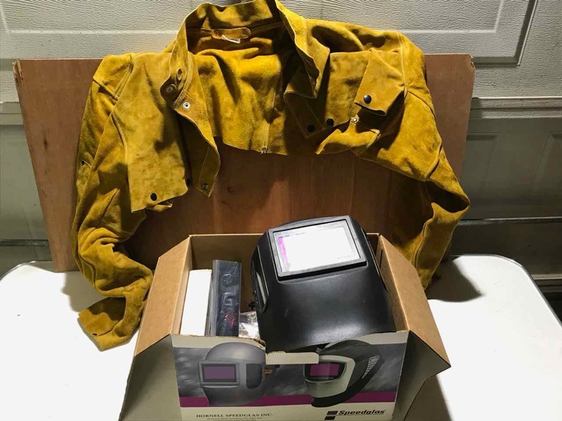 lot 84 image: Welding Helmet and leathers.  (Helmet is auto darkening)