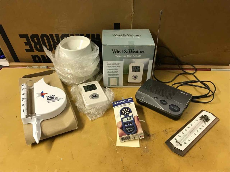 lot 145 image: Weather Radio, rain gauge, Kestrel wind speed meter, wireless rain gauge