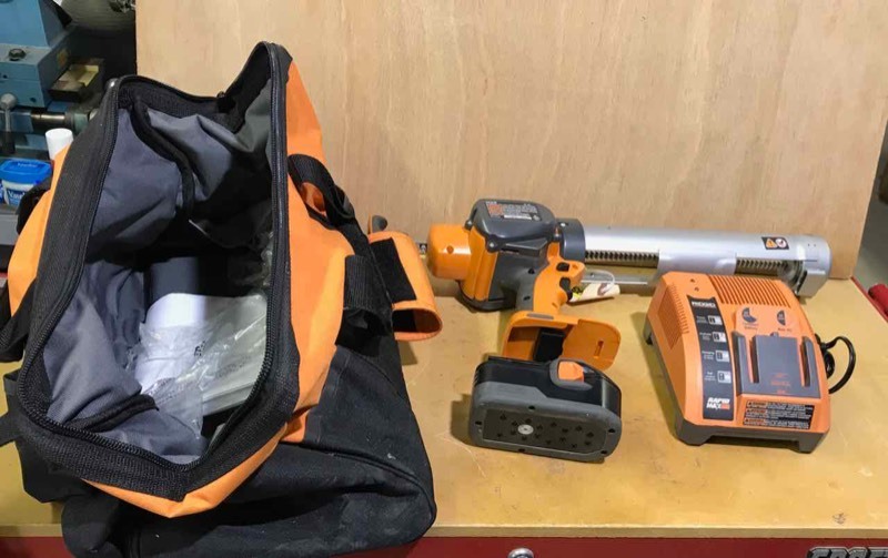 lot 203 image: Ridgid 18 volt Caulk Gun with case, charger and one battery