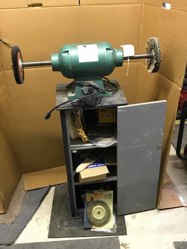 lot 205 image: Grizzly Model G1061 Knife BufferGrinder, One Horsepower, 3450 RPM on cabinet with assorted wheels and brushes