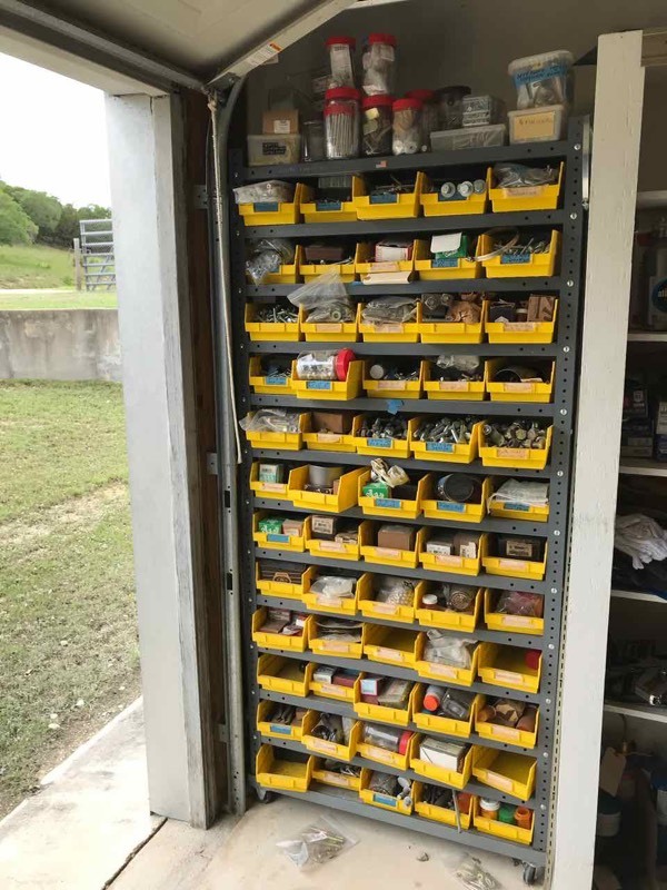 lot 287 image: WOW  Bolts, nuts, washers, etc...on metal stand with wheels and yellow bins.