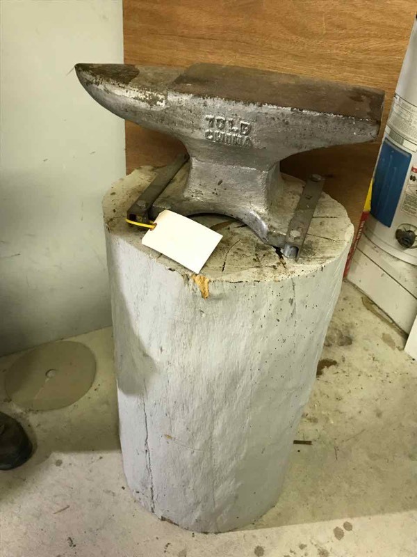 lot 312 image: Large, 70 lb. Anvil (China) with tree stump base