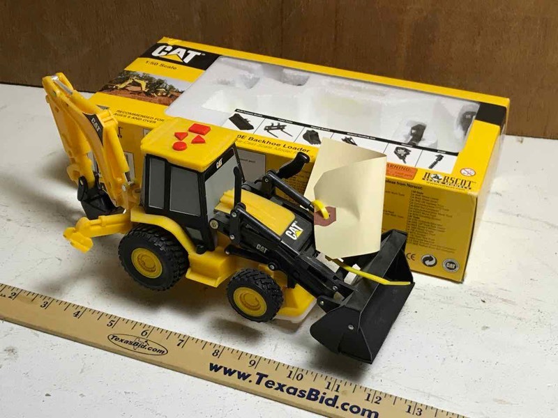 lot 341 image: Miniature  CAT 150 Scale Backhoeb with box, makes tractor noises