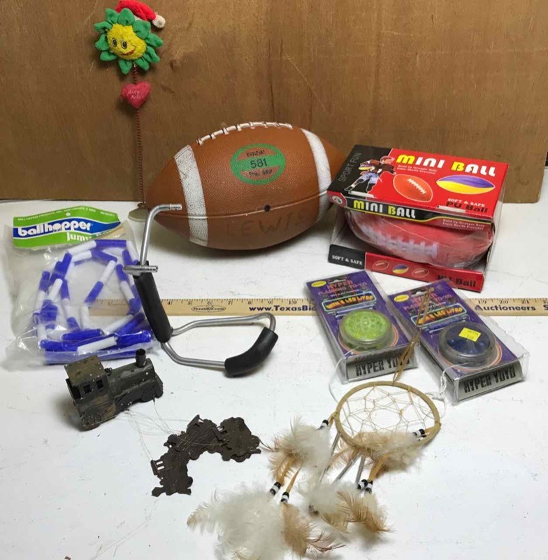 lot 344 image: Box of toys  wrist rocket, yoyo, football, dream catcher, train windchime