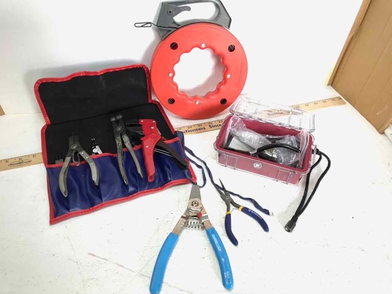 lot 614 image: Box of Electrician Fish Tape, Pliers, Pelican case