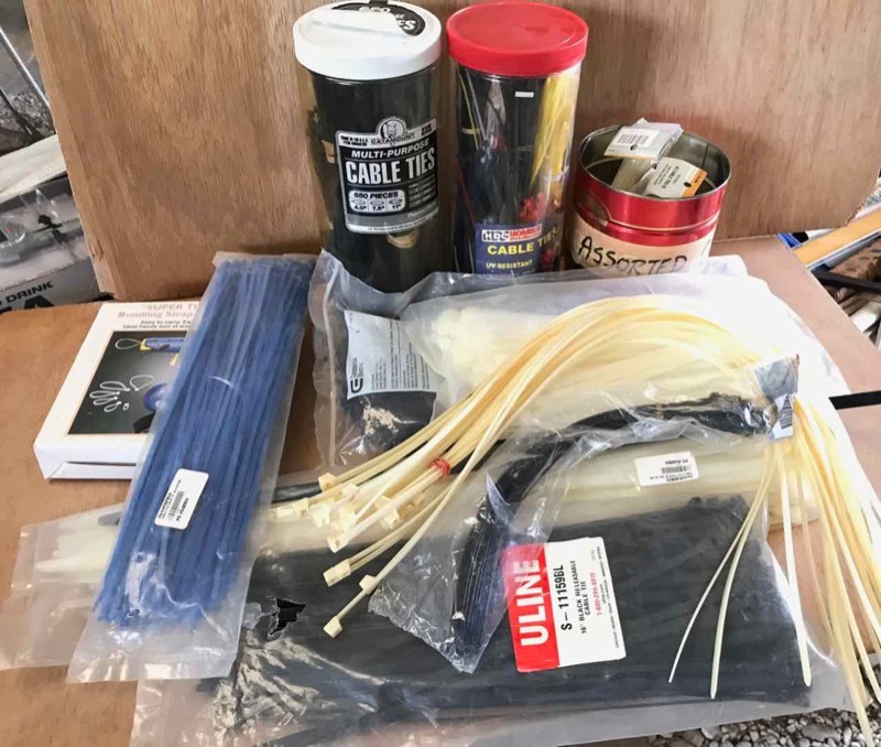 lot 745 image: Assorted Cable ties and quantities, Super Tight bundling strap dispenser