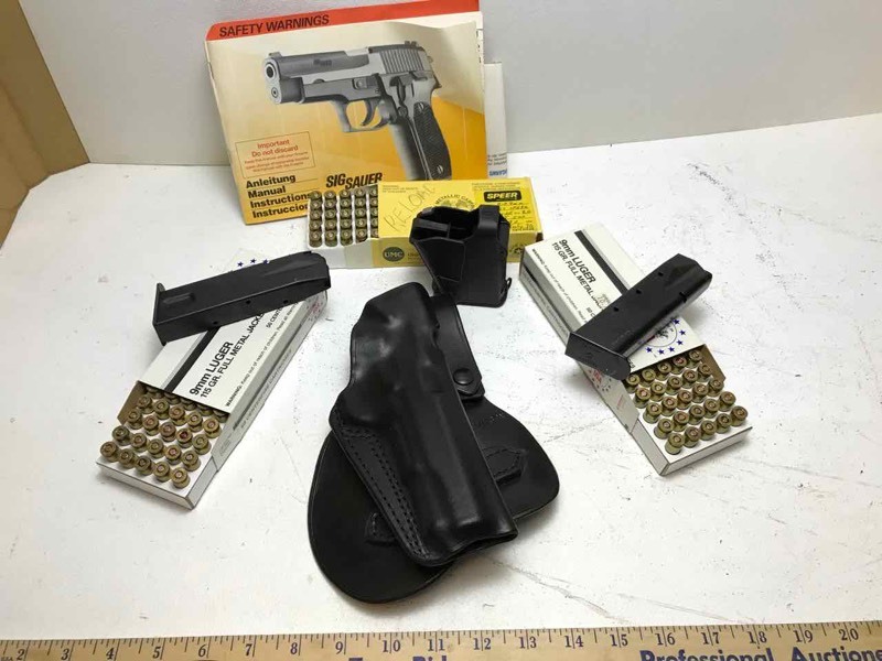 lot 751 image: Sig Sauer P226 Paddle Holster, two magazines, assorted ammo and reloads
