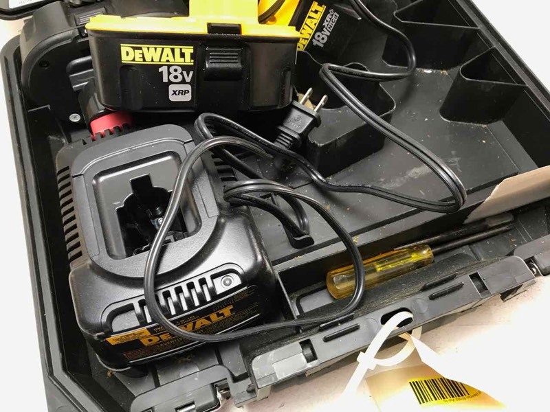 lot 823 image: DeWalt 18 Volt 12 inch impact wrench, (3) batteries, (1) charger. (We charged it up and it worked)