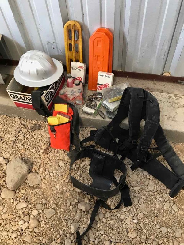 lot 854 image: Chain Saw EquipmentAccessories safety helmet, harness, lubricants, chains, bar covers