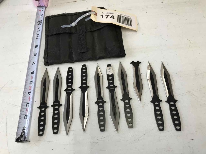 lot 174 image: (9) Throwing Knives in Nylon Canvas Holder