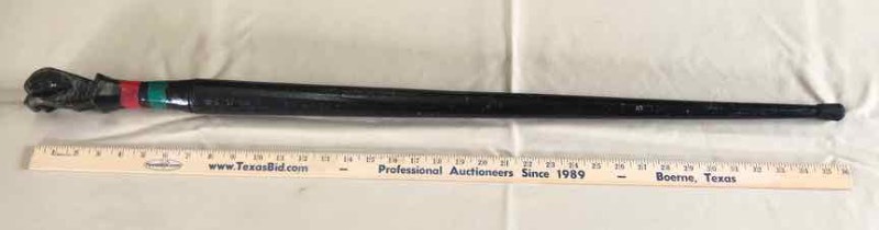 lot 49 image: Walking Cane Carved Wood Fist, Painted Black, Red & Green Tape