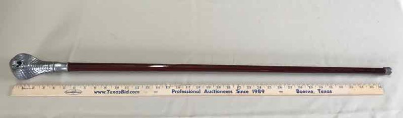 lot 126 image: Walking Stick Pewter, Cobra with red eyes, heavy head