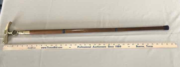 lot 144 image: Flask Cane  Firemans Brass Hammer Sickle (holds 1 corked flask)