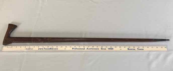 lot 150 image: Cane Wood, Carved, looks like a hatchet Zakopane
