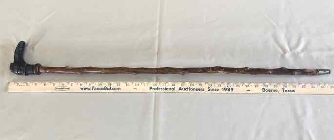 lot 172 image: Antique Folk Art Cane Shoe with Sock, Knotty Shaft