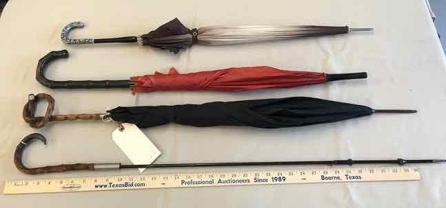 lot 213 image: (4) Umbrella Canes