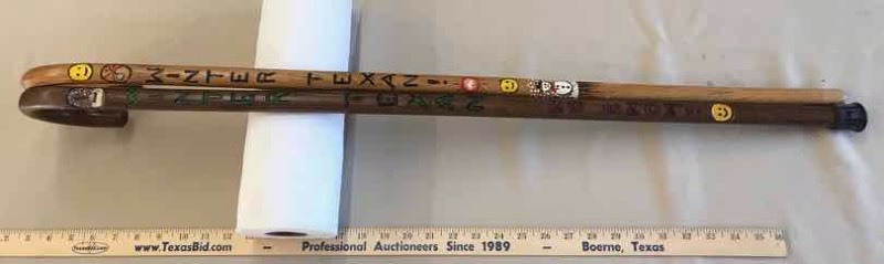 lot 217 image: (2) Canes Carved Winter Texan