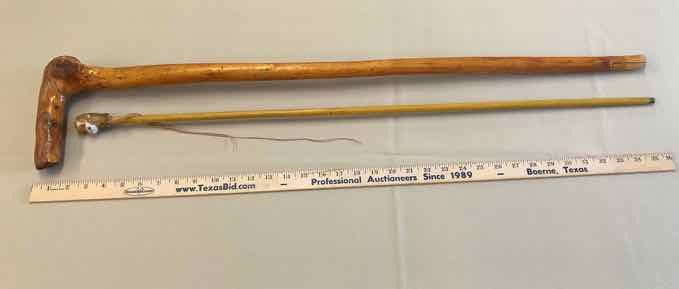 lot 230 image: (2) Canes Mokey (1 Carnival Cane, 1 Carved Wood)