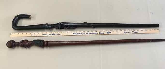 lot 243 image: (2) Canes Tanzania Ebony (Woman & Snake) & Ball Top Carved Face