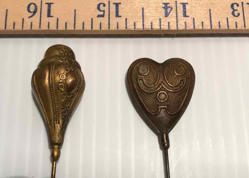 lot 325 image: (2) Hat Pins  Metal Art Deco Styled Heart Shape & Gold-Tone Dome Shaped