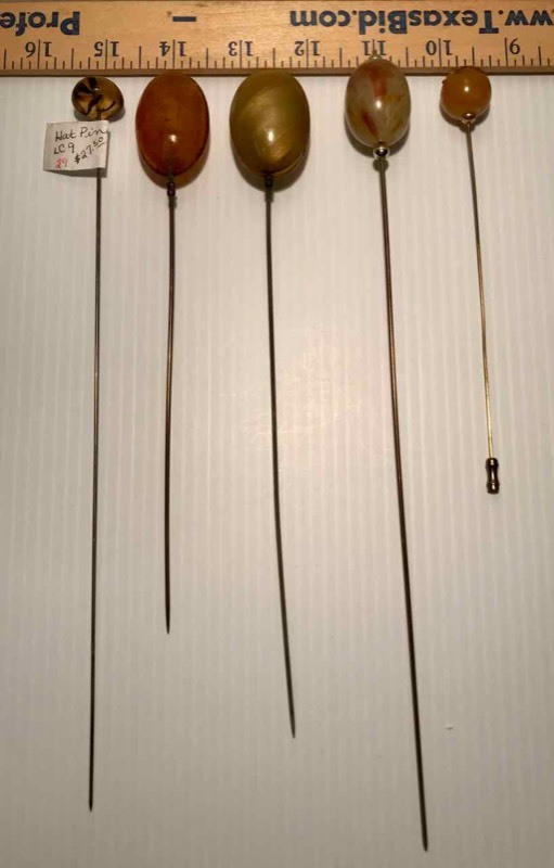 lot 423 image: (5) Hat Pins PlasticCelluloid (tansbrowns)