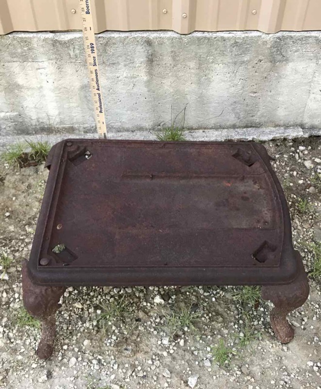 lot 530 image: Cast Iron Wood-Stove Footed Base (rectangular)