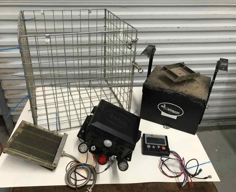 lot 575 image: WildGame Hog Light 6 volt, WildGame Feeder, 12 volt, extra timer, solar panel, crater cage