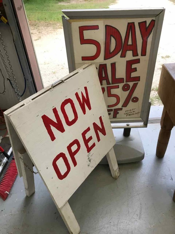 lot 670 image: (2) Signs  Wood Sandwich Board & Water Filled Base