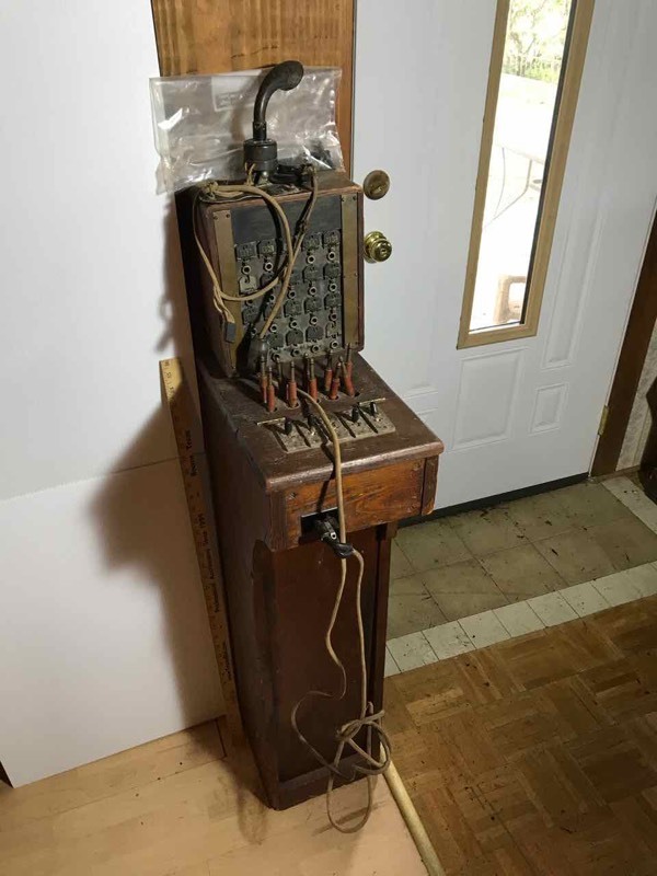 lot 49 image: Living Room Antique Switchboard, Ear Piece, Mouth Piece Property of American Tel & Tel Co. Patd 1918