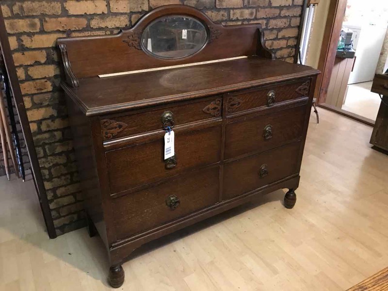 lot 73 image: Kitchen Antique Tiger Oak Server with Six Drawers, Oval Beveled Mirror Back