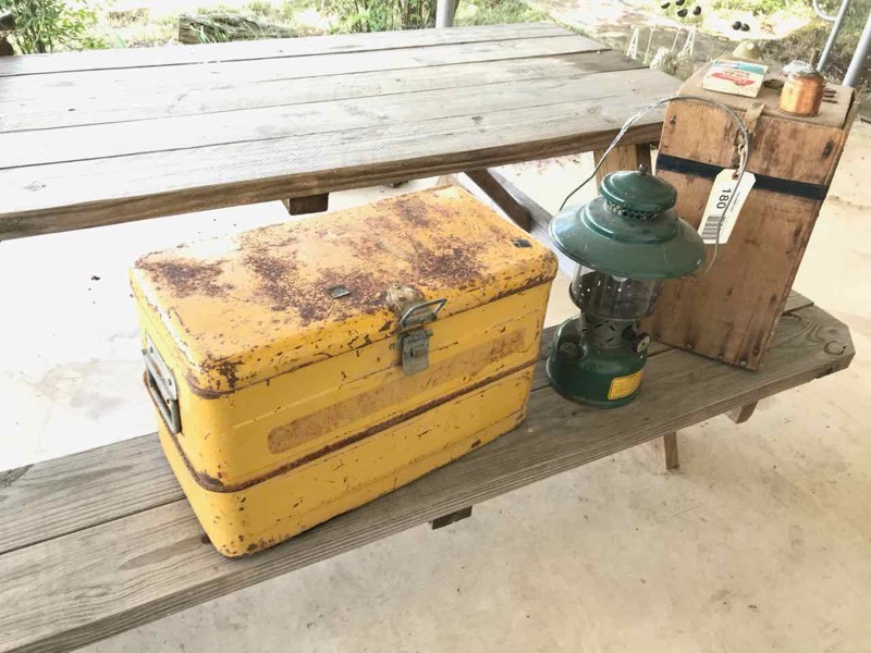 lot 180 image: Front Room Coleman Lantern with Wood Box, Old Metal Yellow Cooler